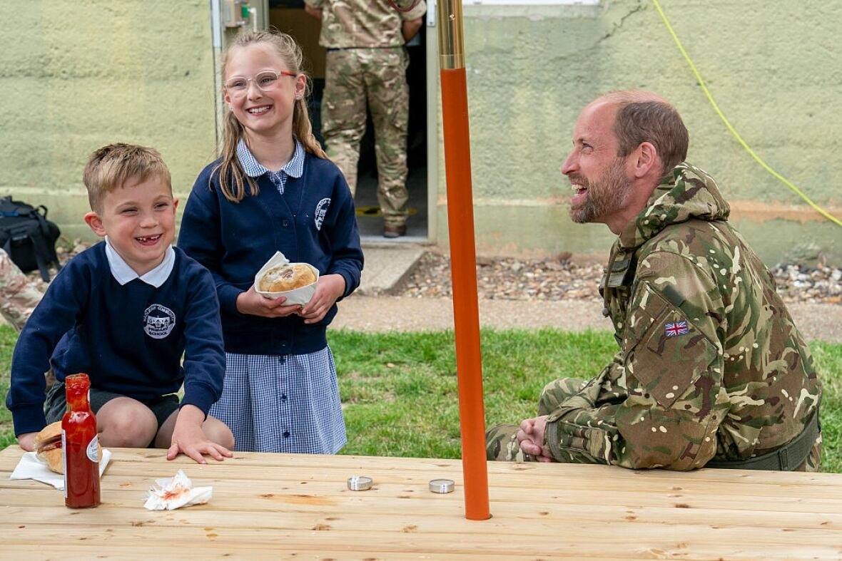 Prince william sits chatting children staff army air corps wattisham eastern england june4.