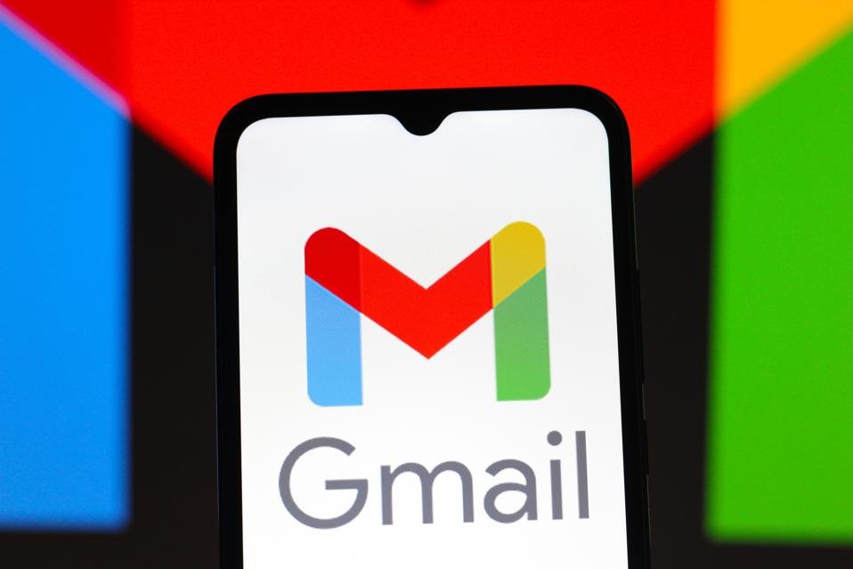 Gmail logo displayed on smartphone with Google brand colors in the background
