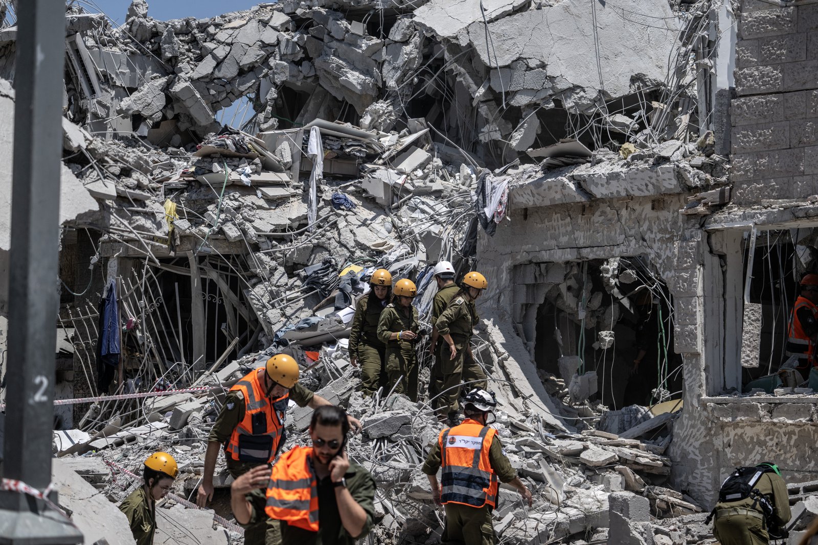 Israeli rescue team working amid rubble after missile attack
