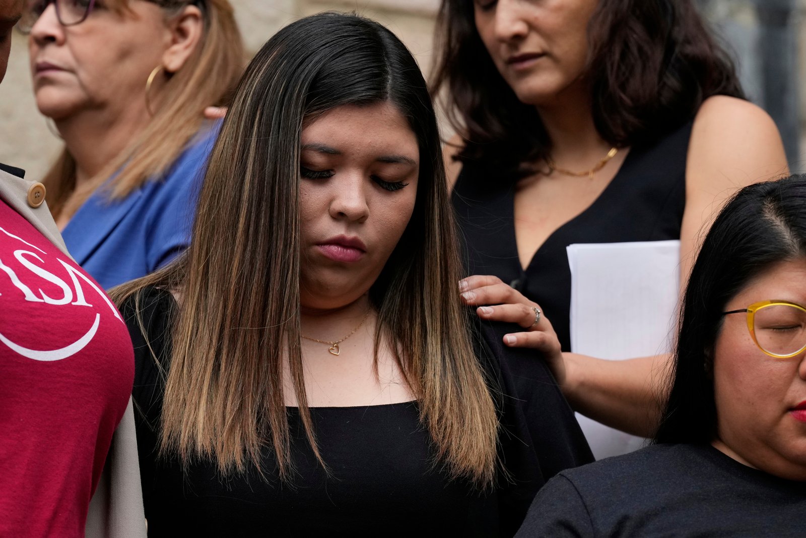 Jennifer Vasquez Sura comforted at press conference