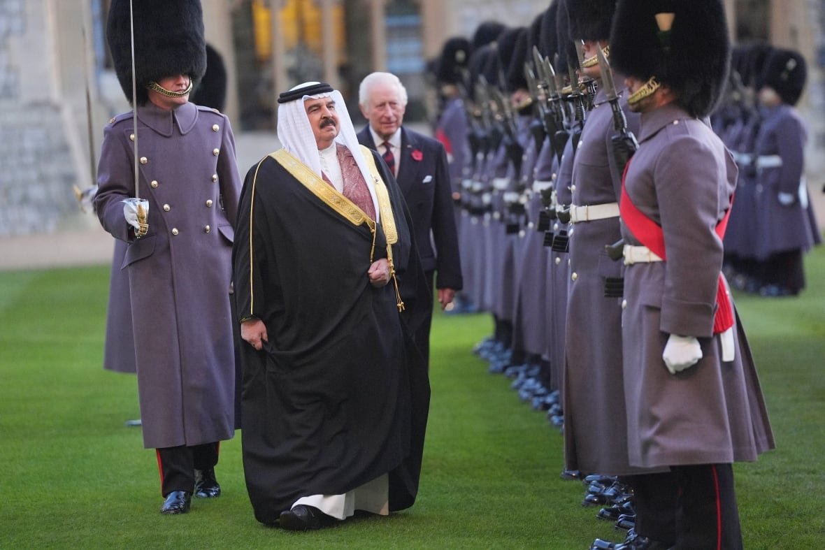 King Charles with Bahrain's king inspecting guards at Windsor Castle