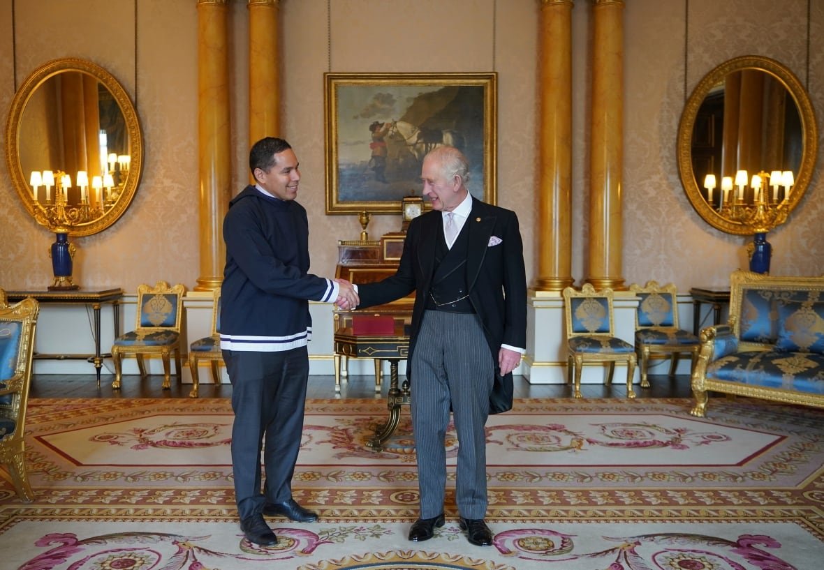 Natan Obed shaking hands with King Charles at Buckingham Palace