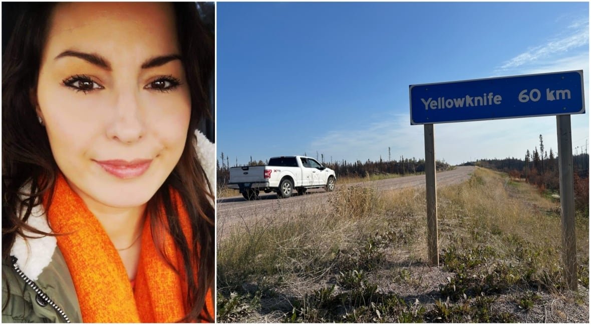 Woman smiling beside clear blue sky highway sign pointing toward Yellowknife.