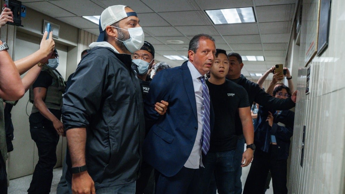 Brad lander being arrested outside manhattan immigration court
