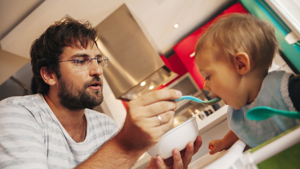 Father teaching his son a new skill
