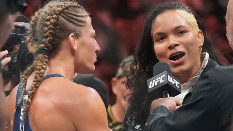 Kayla Harrison talks with Amanda Nunes after women's bantamweight bout at UFC 316
