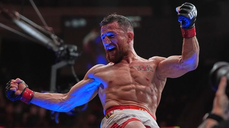 Georgia's Merab Dvalishvili celebrates after winning bantamweight title against Sean O'Malley at UFC 316