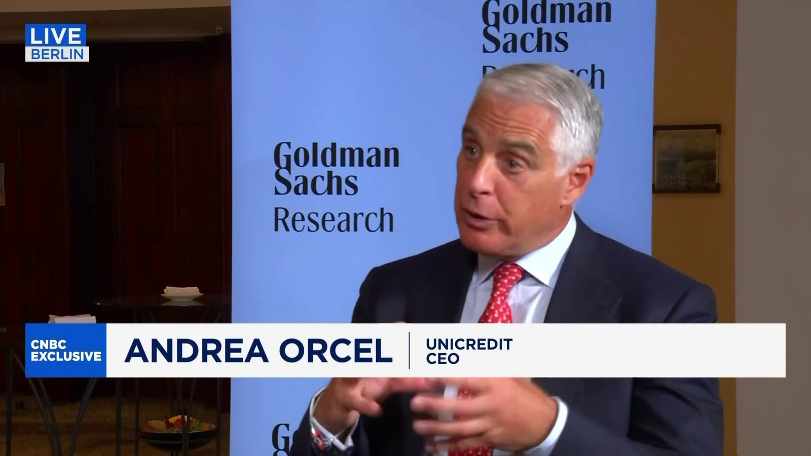 UniCredit CEO Andrea Orcel emphasizing political impact on business