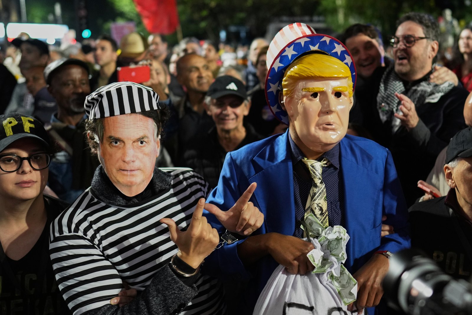 Protesters wearing masks of Donald Trump and Jair Bolsonaro in Sao Paulo