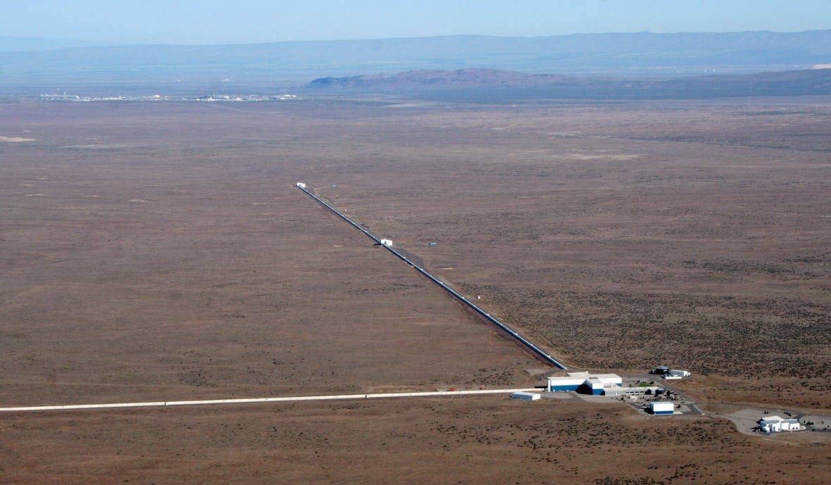 L-shaped interferometer arms stretching across arid landscape at LIGO Hanford