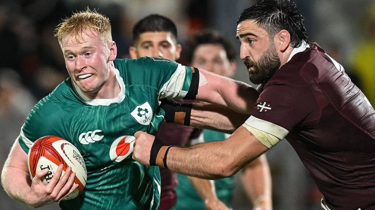 Jamie Osborne of Ireland tackled during match against Georgia