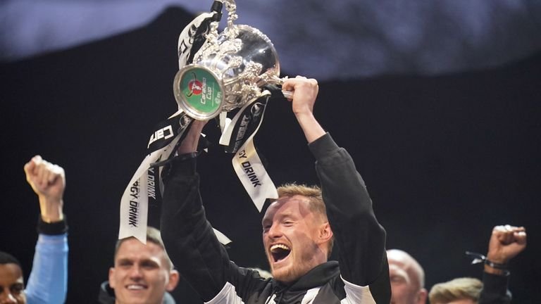 Sean Longstaff celebrating after helping Newcastle win domestic silverware