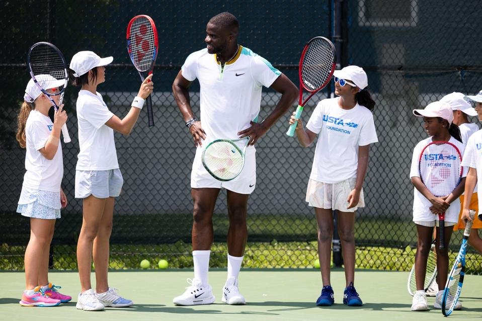 Frances Tiafoe leading youth tennis clinic