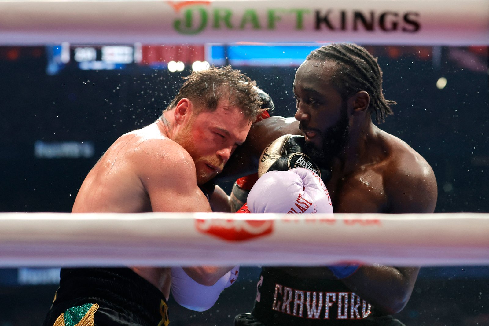 Canelo Alvarez and Terence Crawford exchanging punches during their fight