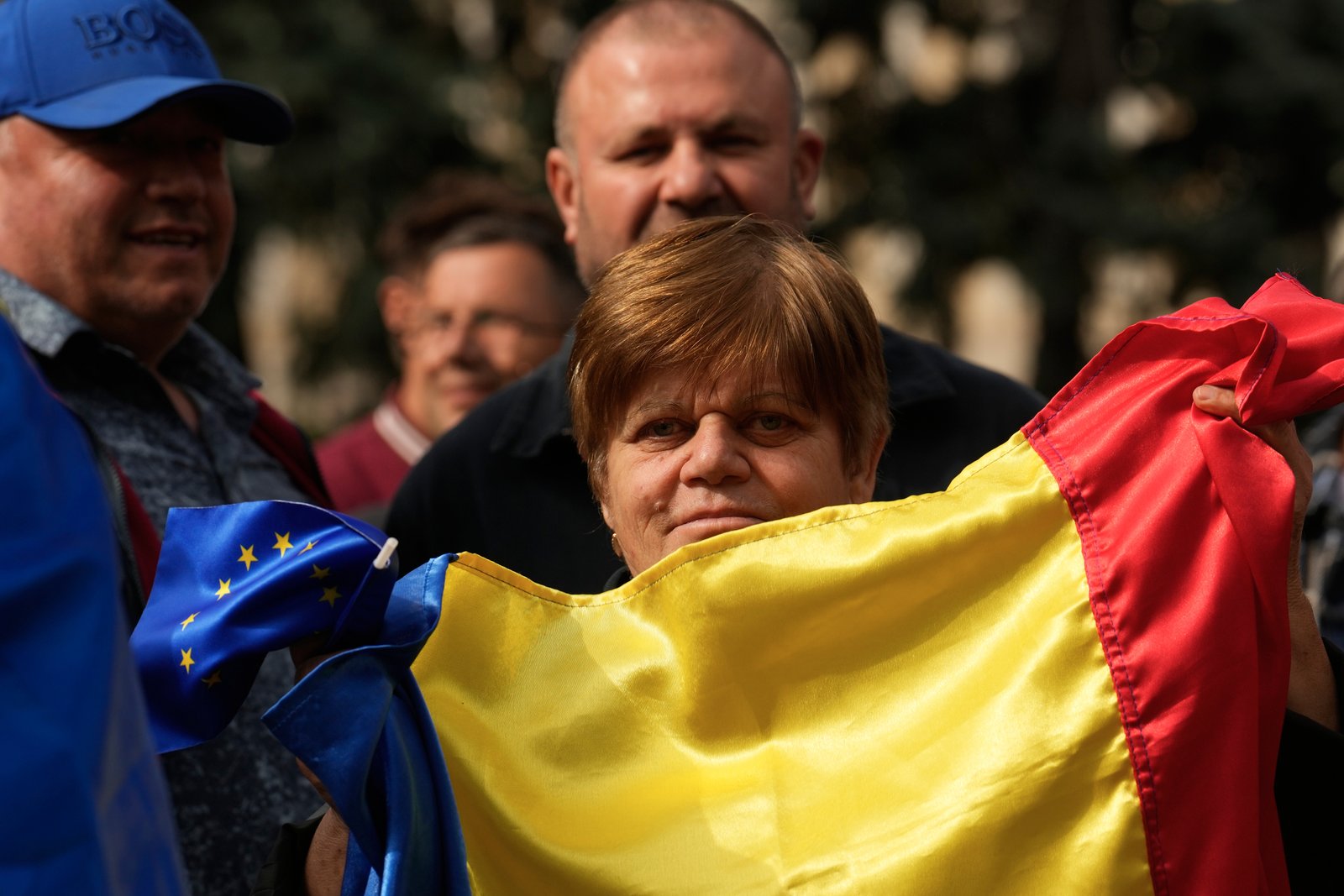 Supporters waving Moldovan flags at rally