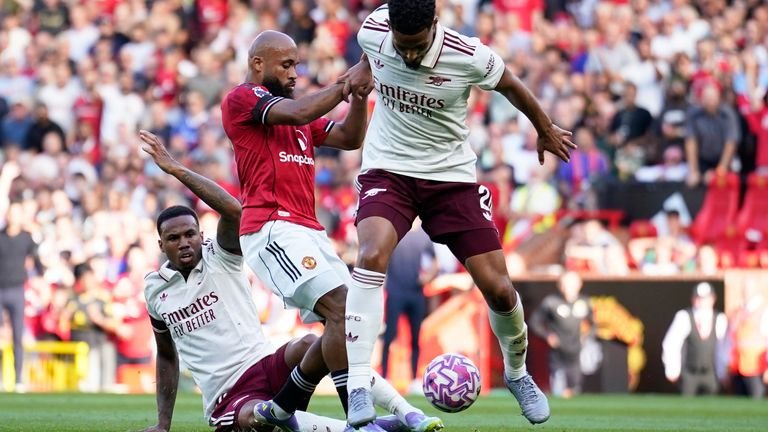 Arsenal's Gabriel Magalhaes and William Saliba contesting possession