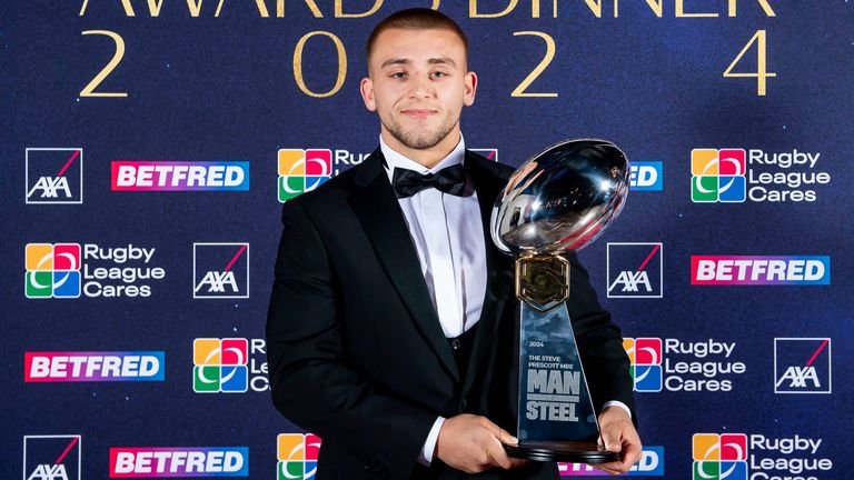 Mikey Lewis receiving Man of Steel award