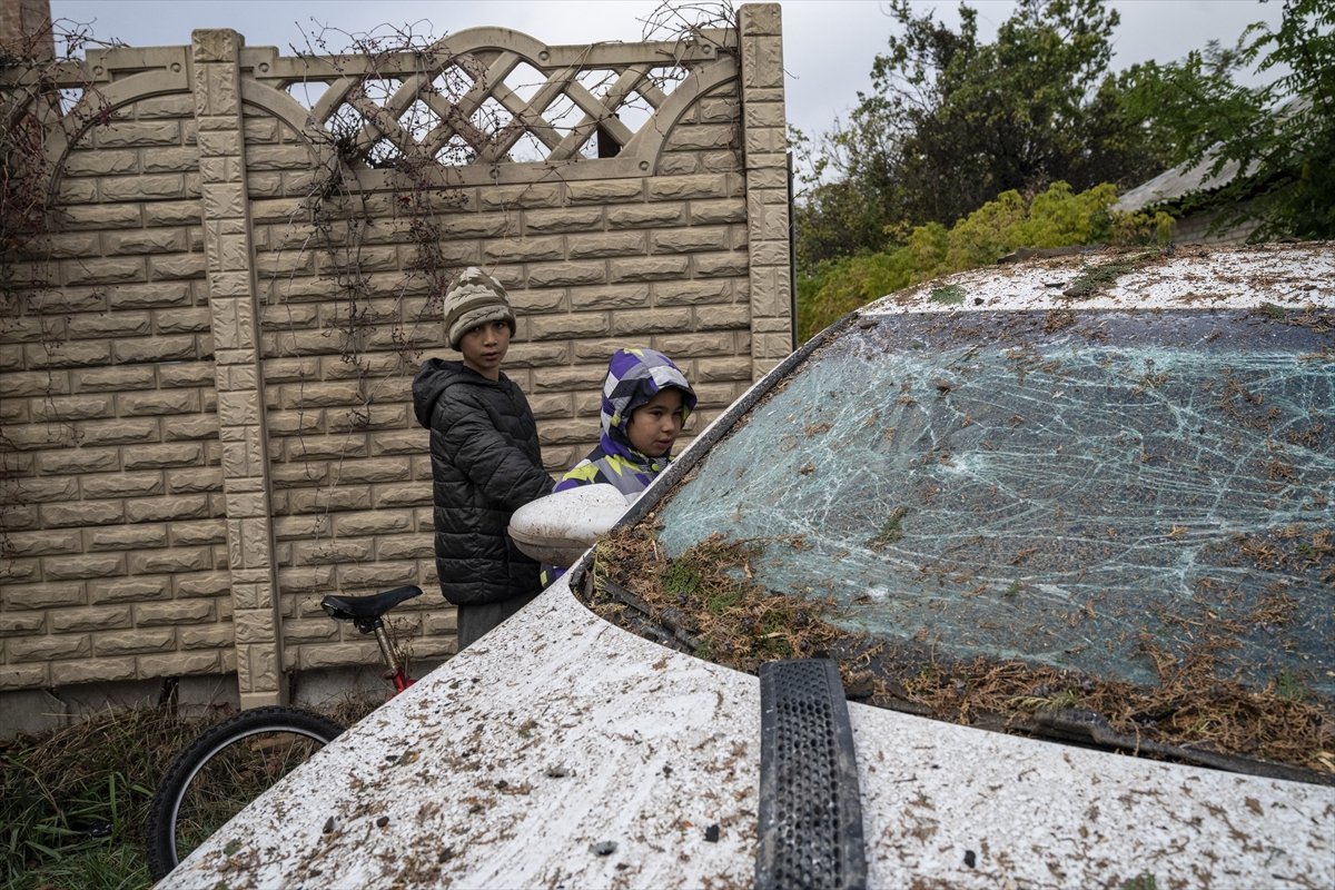 Children observing damage after a Russian Geranium-2 drone strike in a residential district of Sloviansk, Ukraine, October 20, 2025.The drone hit Bohun Street causing destruction to homes and vehicles.