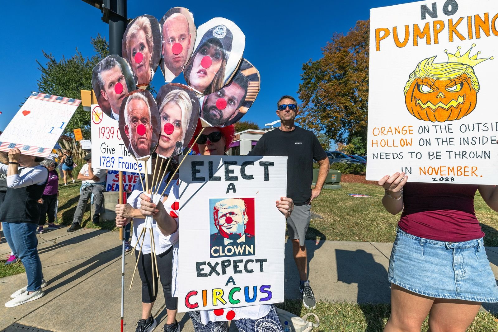 Sign featuring clowns at Cornelius protest