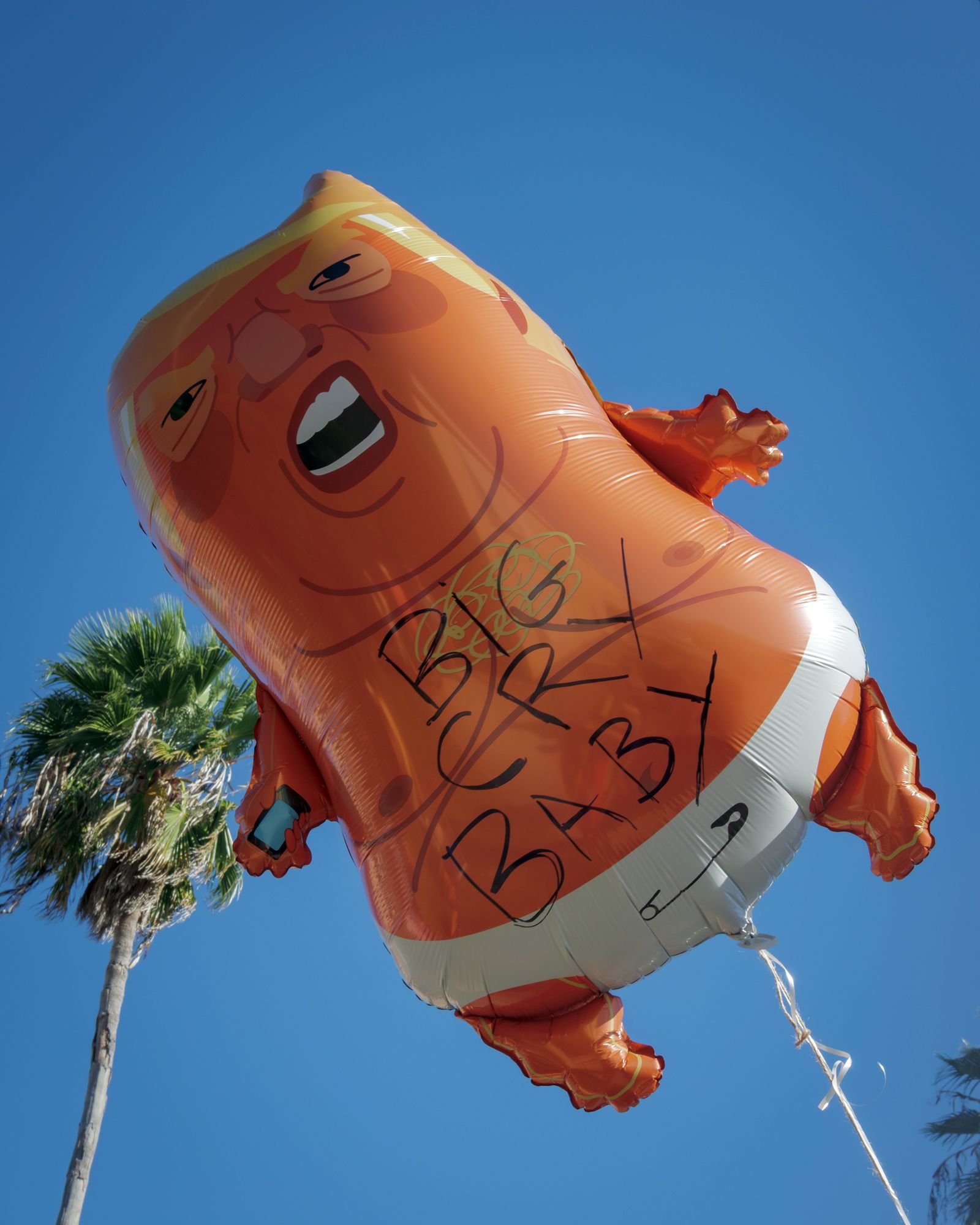 Large balloon depicting political figure at Venice protest