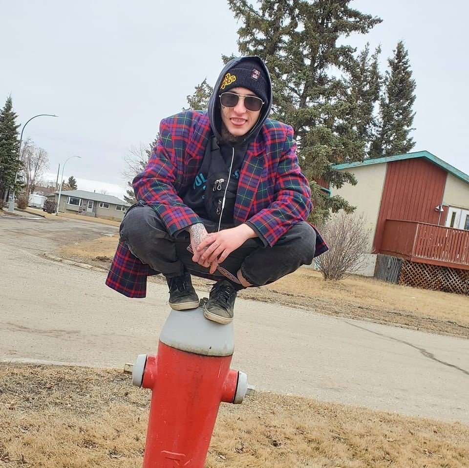 Nolan Schmidt posing on fire hydrant