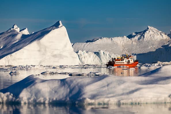 icebergs floating off Nuuk coast surrounded by melting glaciers
