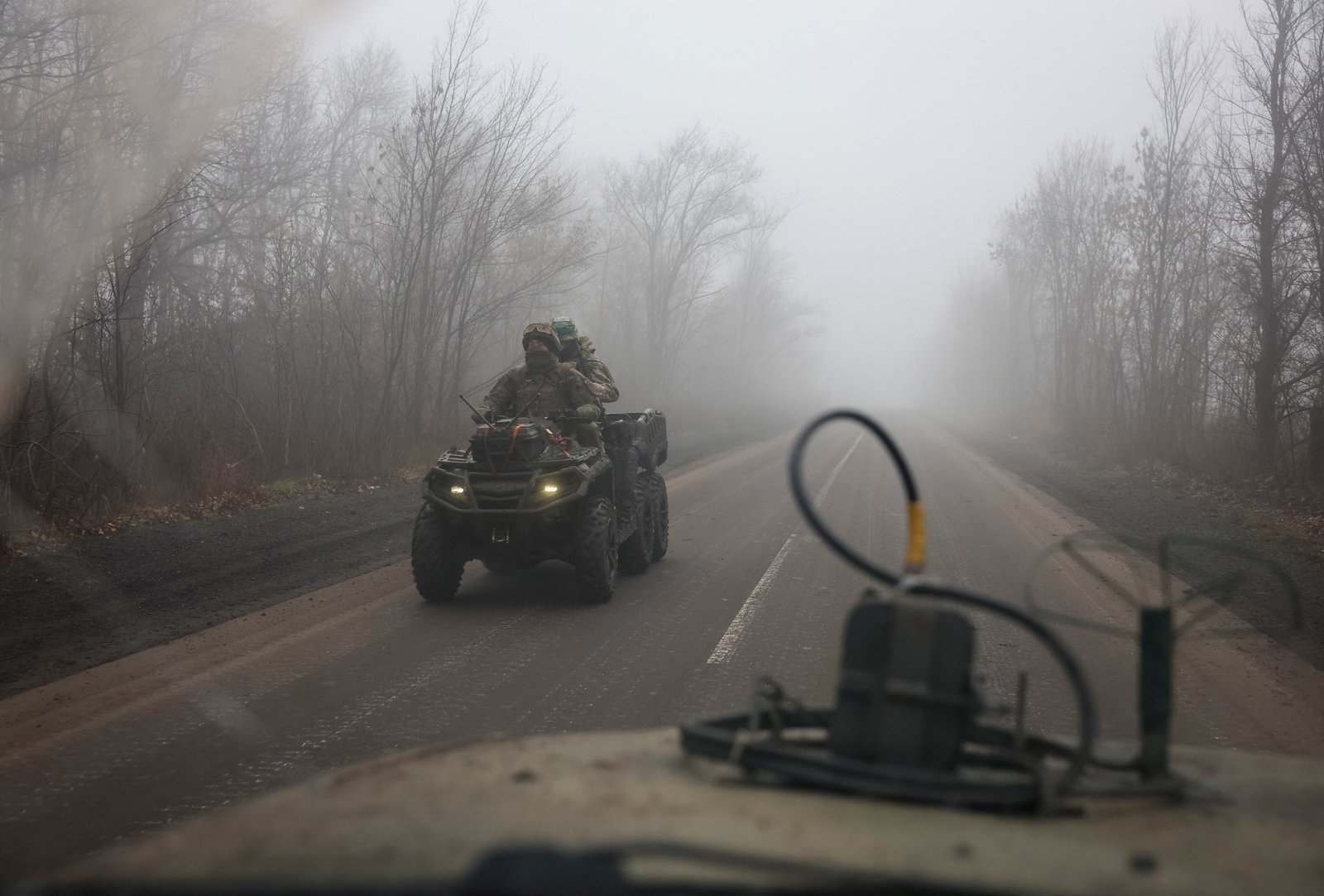 Ukrainian soldiers riding a military buggy near the frontline in Pokrovsk, donetsk region