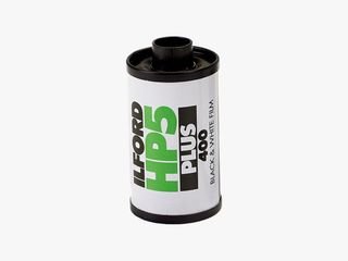 Small plastic canister labeled Ilford HP5 Plus black & white negative film