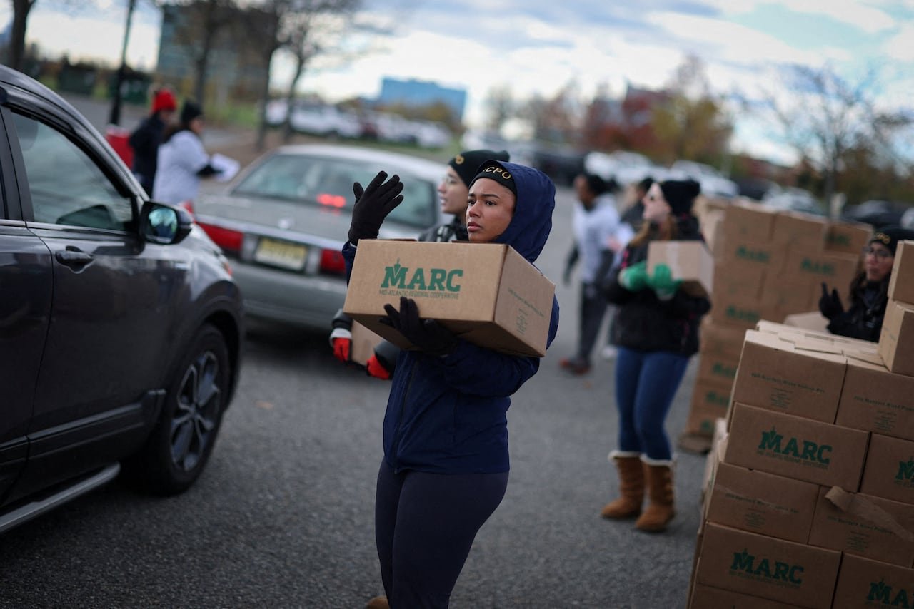 Volunteers distributing emergency food supplies at community event