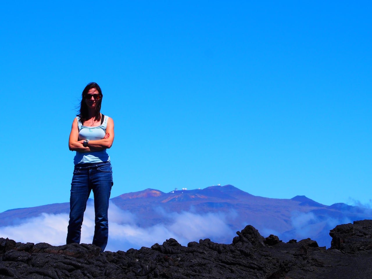 sara Seager standing outdoors near observatories