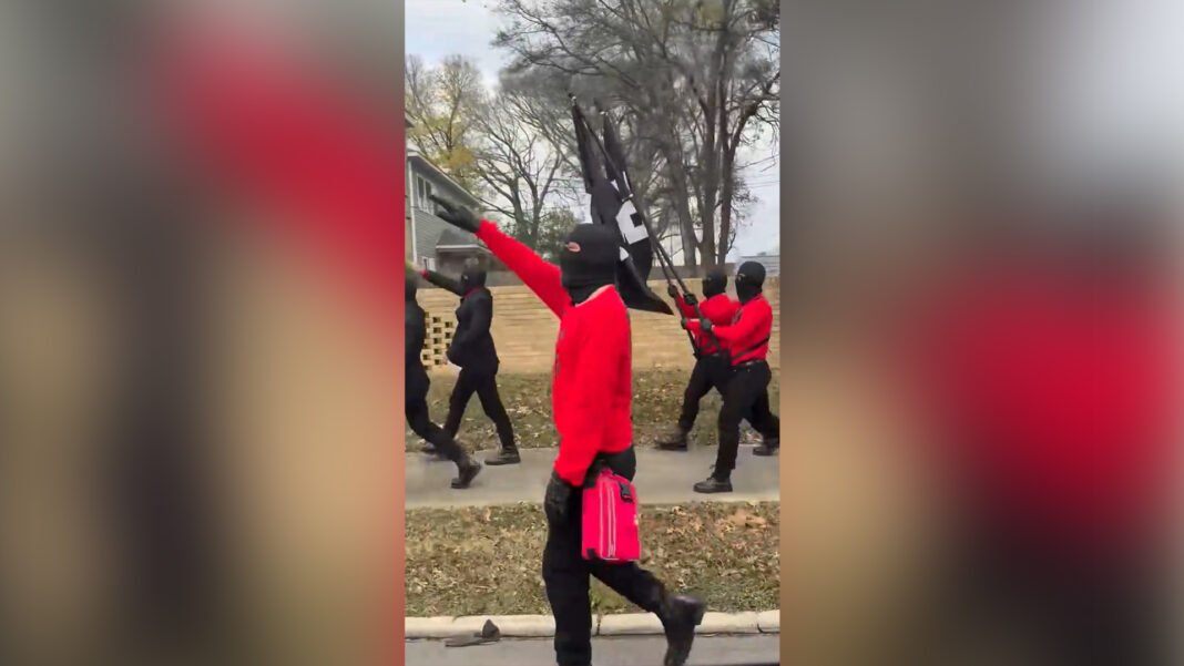 Masked neo-Nazis march through Arkansas community