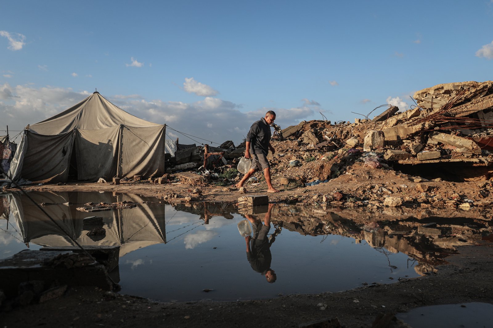 Flooding damages tents housing displaced Palestinians after heavy rain in ‌Gaza