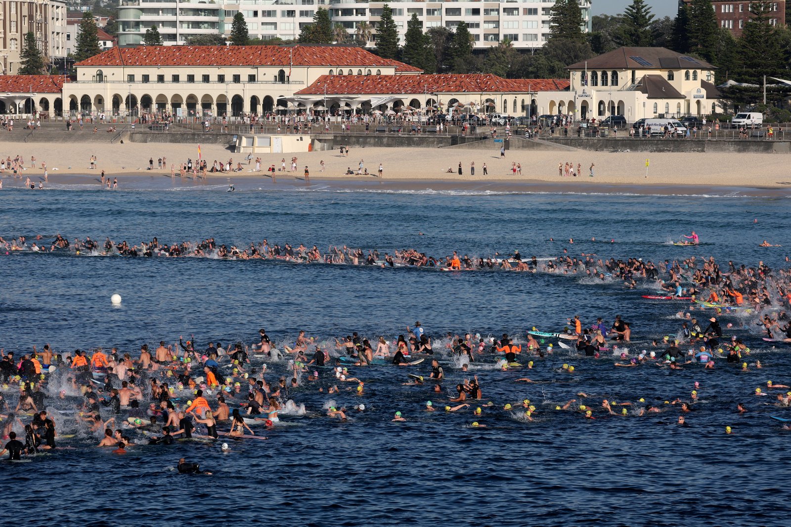 Surfers paying tribute at Bondi Beach following tragic shooting