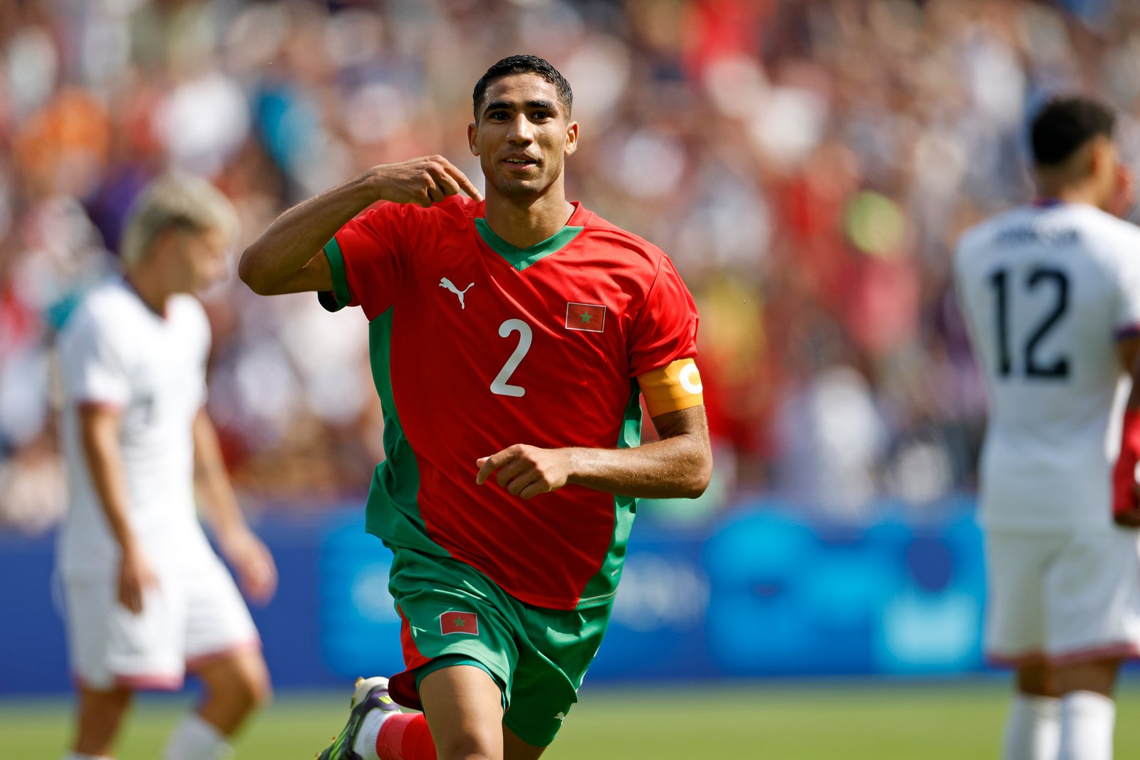 Achraf Hakimi celebrating a goal during an international match