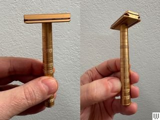 Close-up image showing hand gripping metallic gold safety razor