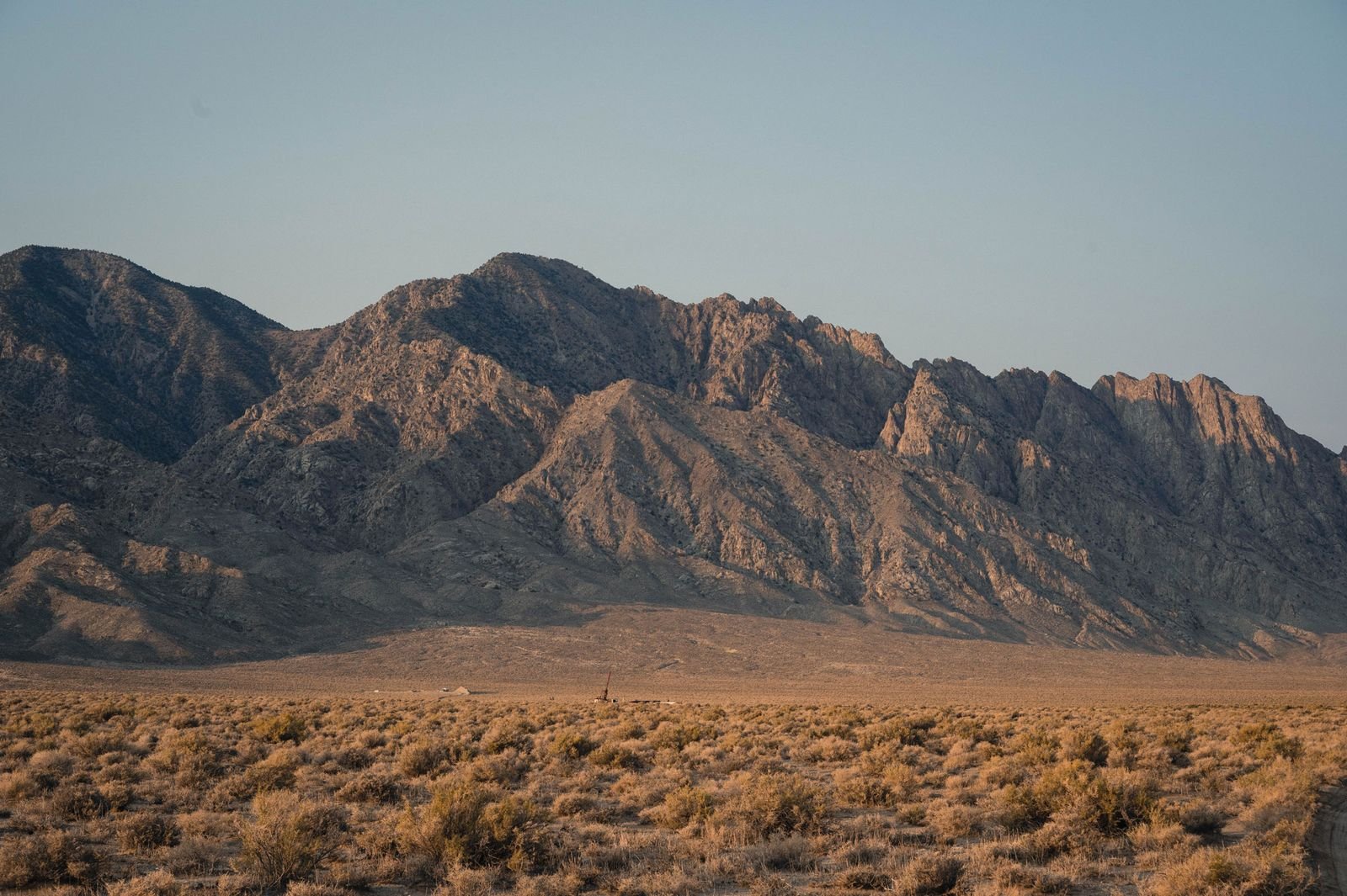 Mountain range landscape representing⁣ geothermal exploration