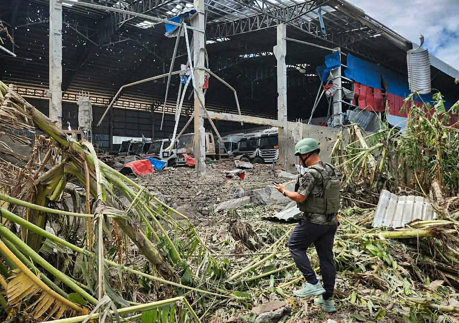 Resident surveys damage after airstrikes hit Poipet town near Thailand-Cambodia border
