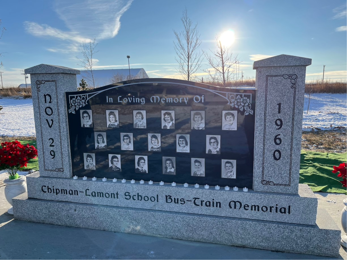 Engraved stone monument honoring crash victims