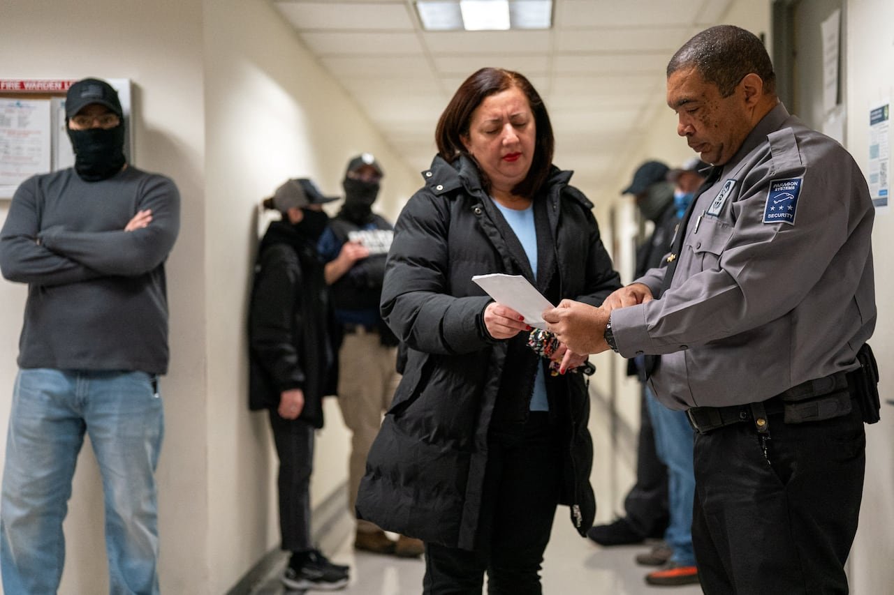 Immigration court scene showing interaction between attendees