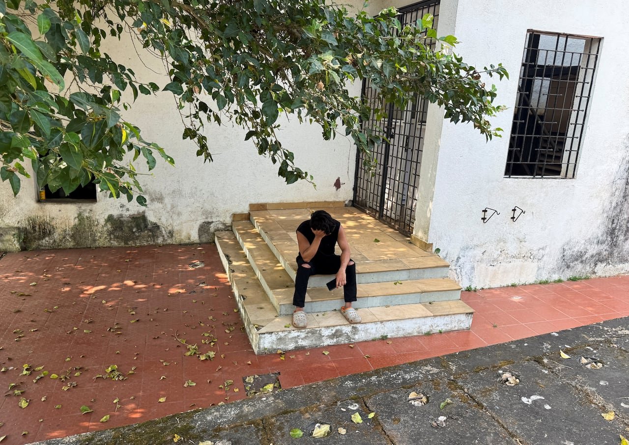 Grieving man outside hospital after losing family member in nightclub blaze