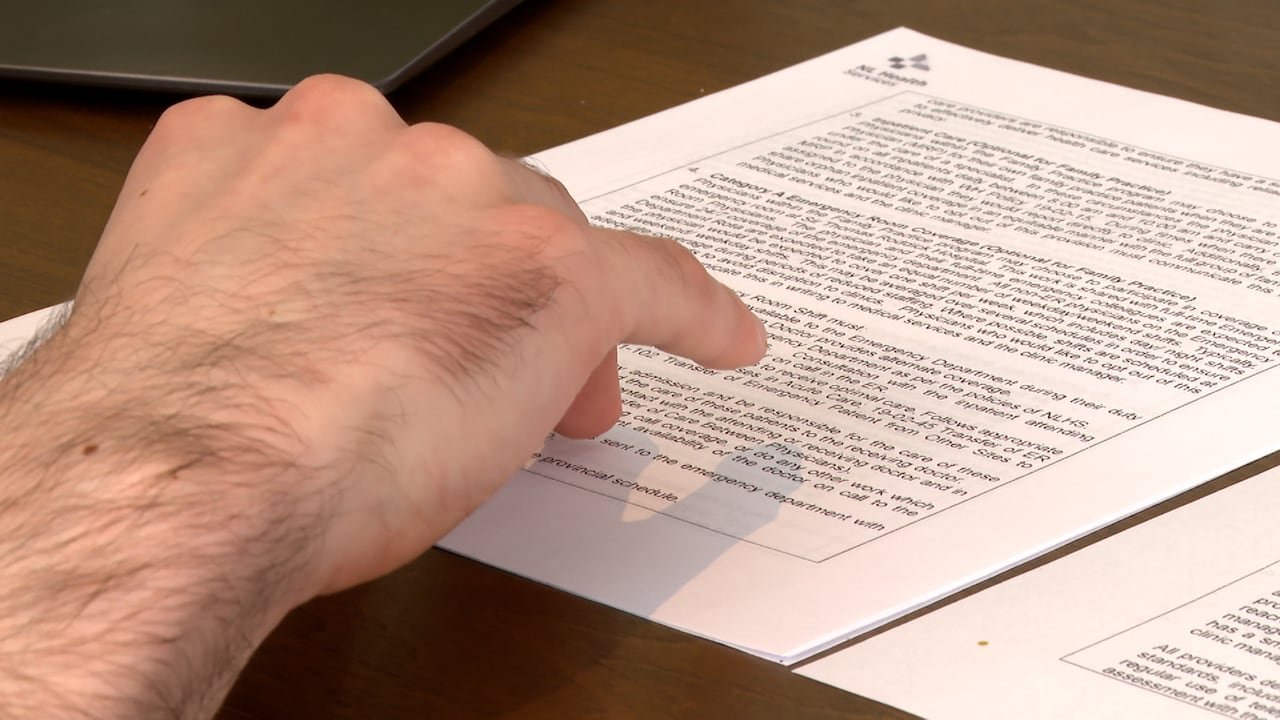 Physician reviewing medical documents