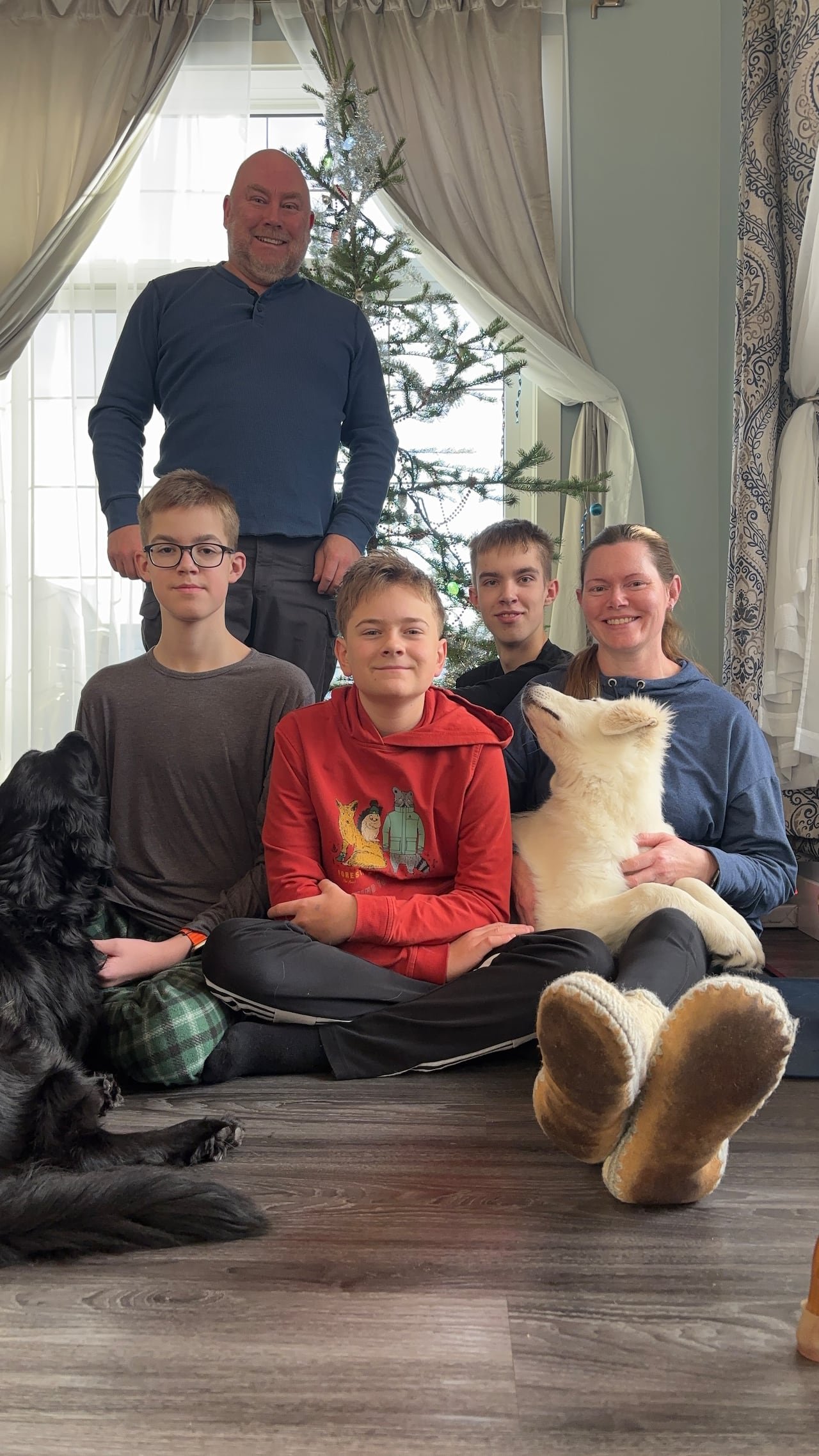 Jason Hydamacka smiling with family