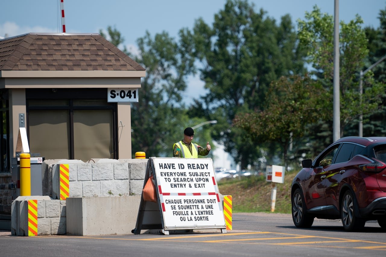 Canadian Armed Forces member standing guard at base entrance