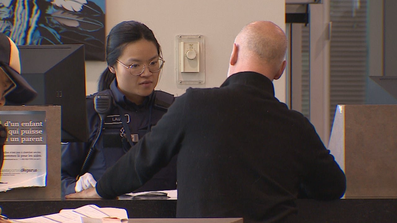 CBSA officer assisting traveler.