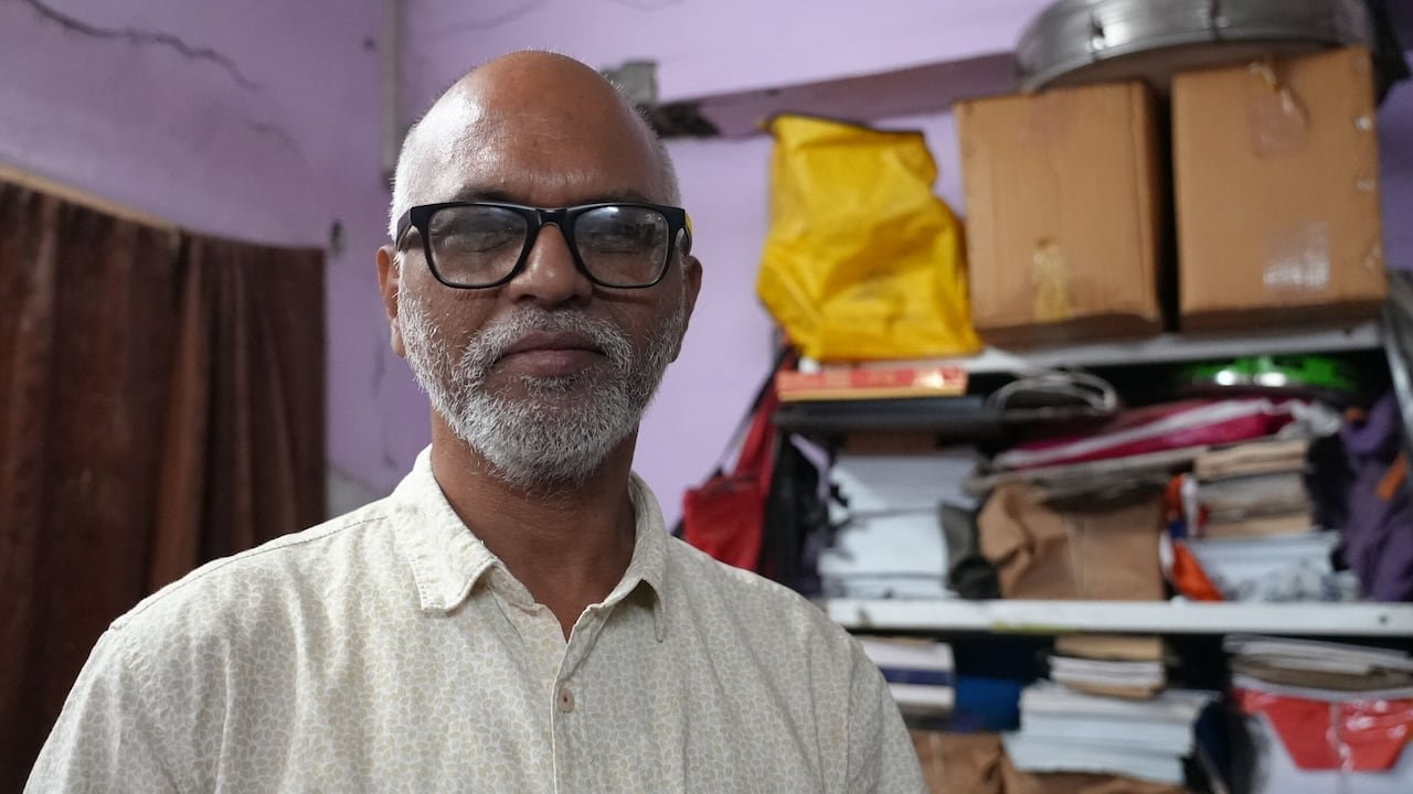 Activist standing beside shelves filled with legal files
