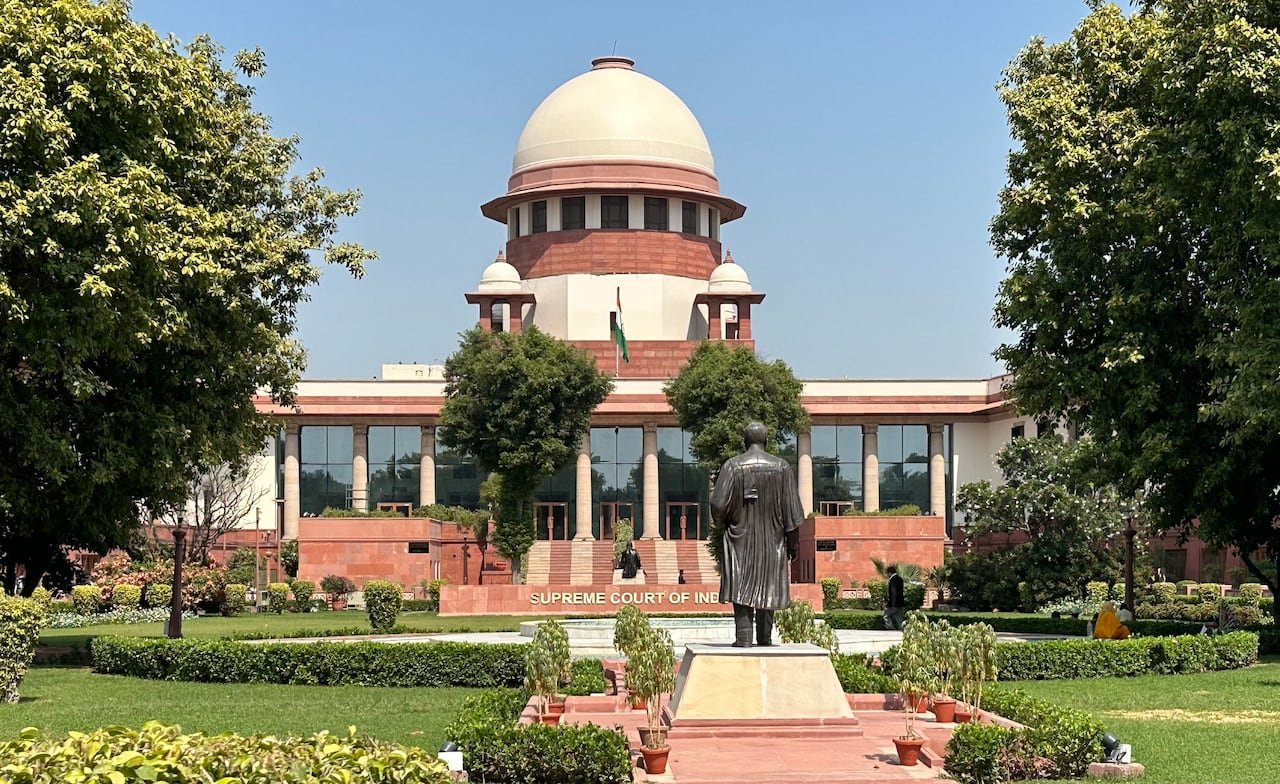 Supreme Court building surrounded by greenery