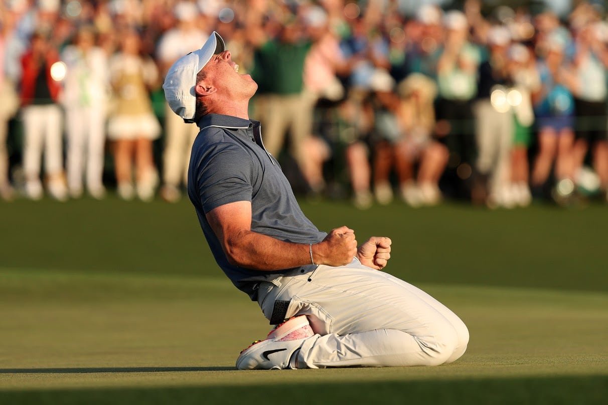 Golfer celebrating victory on green