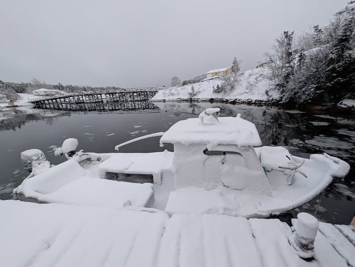 Boat covered by thick snow at Little Bay Islands
