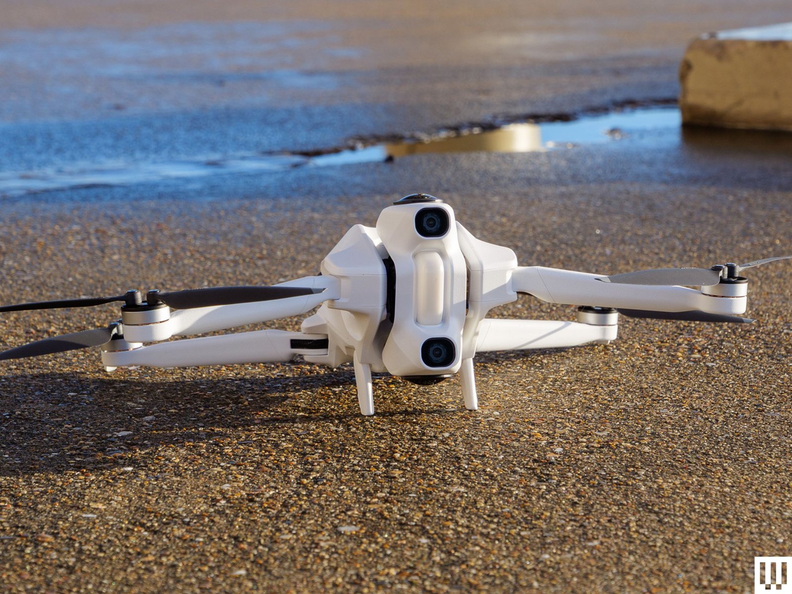 Antigravity A1 resting on pebbled surface