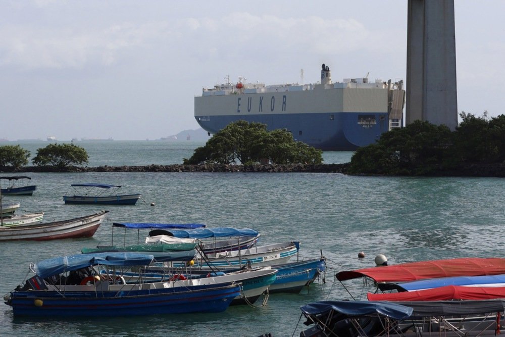 Cargo ship navigating thru locks on Panama Canal